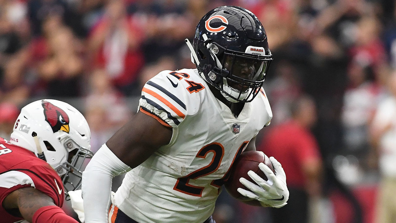 GLENDALE, AZ - SEPTEMBER 23: Running back Jordan Howard #24 of the Chicago Bears carries the ball in front of defensive back Budda Baker #36 of the Arizona Cardinals in the NFL game at State Farm Stadium on September 23, 2018 in Glendale, Arizona.