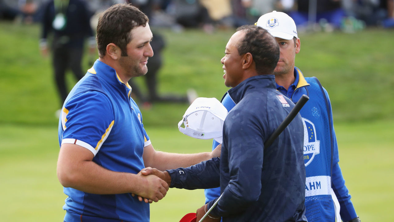 PARIS, FRANCE - SEPTEMBER 30: Tiger Woods of the United States congratulates Jon Rahm of Europe on victory during singles matches of the 2018 Ryder Cup at Le Golf National on September 30, 2018 in Paris, France.
