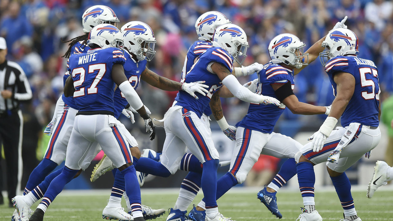 BUFFALO, NY - OCTOBER 07: Cornerback Taron Johnson #24 of the Buffalo Bills celebrates with his teammates after catching an interception in the second quarter against the Tennessee Titans at New Era Field on October 7, 2018 in Buffalo, New York.