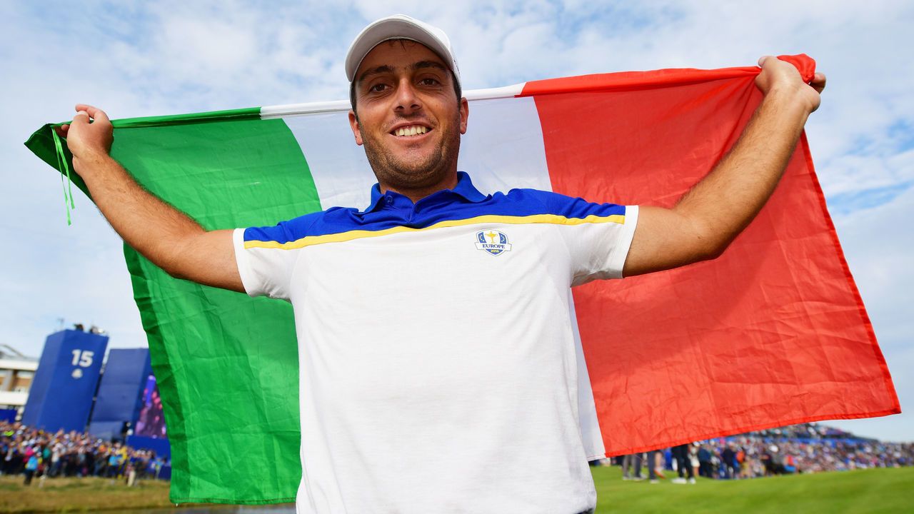 PARIS, FRANCE - SEPTEMBER 30: Francesco Molinari of Europe celebrates winning The Ryder Cup with an Italian flag during singles matches of the 2018 Ryder Cup at Le Golf National on September 30, 2018 in Paris, France.