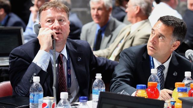 MONTREAL, QC - JUNE 27: (L-R) General Manager Mike Gillis and assistant General Manager Laurence Gilman of the Vancouver Canucks sit at the draft table during the 2009 NHL Entry Draft at the Bell Centre on June 27, 2009 in Montreal, Quebec, Canada.
