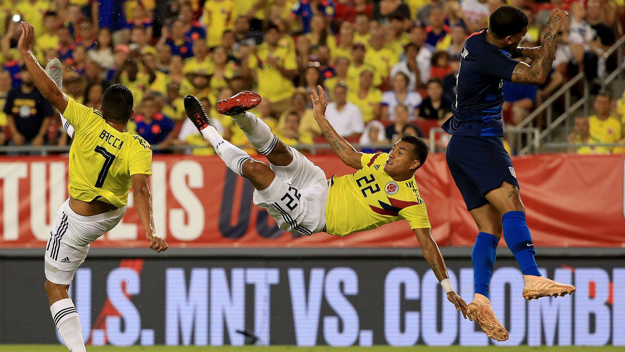 TAMPA, FL - OCTOBER 11: Jeison Murillo #22 of Colombia takes a shot on DeAndre Yedlin #2 of Unites States during an International Friendly at Raymond James Stadium on October 11, 2018 in Tampa, Florida.