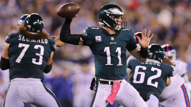 EAST RUTHERFORD, NJ - OCTOBER 11: Carson Wentz #11 of the Philadelphia Eagles attempts to make a pass against the New York Giants at MetLife Stadium on October 11, 2018 in East Rutherford, New Jersey.