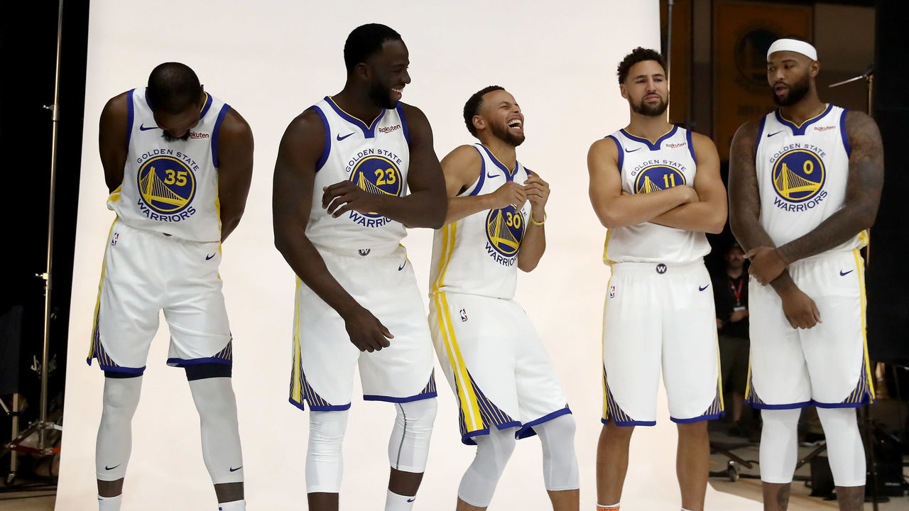 OAKLAND, CA - SEPTEMBER 24: (L-R) Kevin Durant #35, Draymond Green #23, Stephen Curry #30, Klay Thompson #11, and DeMarcus Cousins #0 of the Golden State Warriors pose for a group picture during the Golden State Warriors media day on September 24, 2018 in Oakland, California.