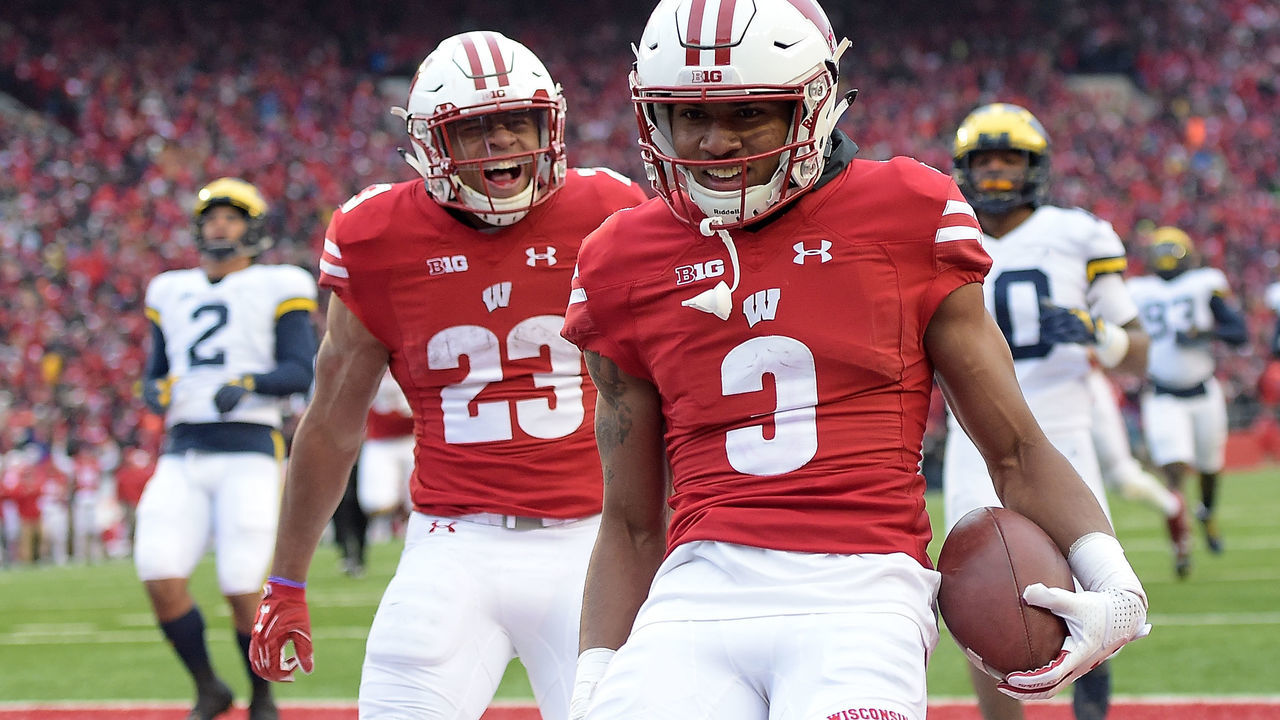 MADISON, WI - NOVEMBER 18: Jonathan Taylor #23 of the Wisconsin Badgers reacts to a touchdown by Kendric Pryor #3 during the third quarter of a game against the Michigan Wolverines at Camp Randall Stadium on November 18, 2017 in Madison, Wisconsin.