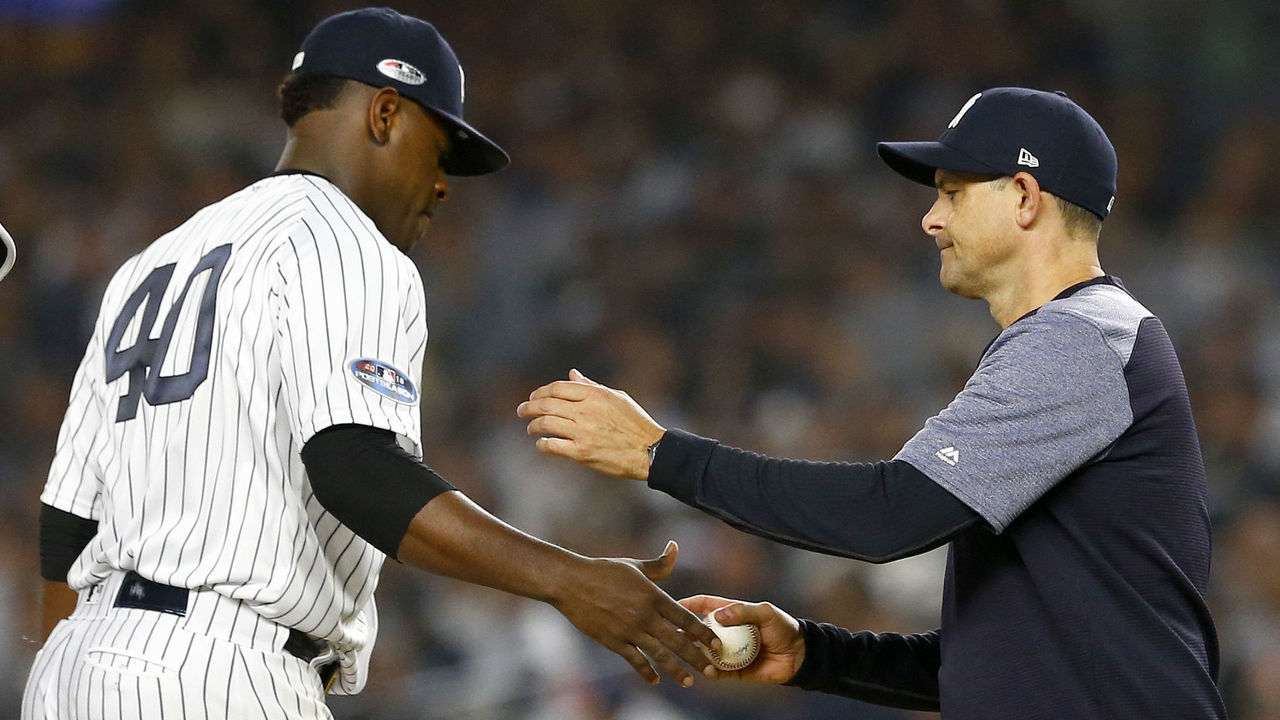 NEW YORK, NEW YORK - OCTOBER 08: Aaron Boone #17 of the New York Yankees pulls Luis Severino #40 against the Boston Red Sox during the fourth inning in Game Three of the American League Division Series at Yankee Stadium on October 08, 2018 in the Bronx borough of New York City.