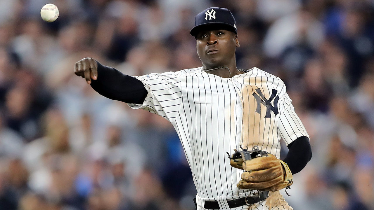 NEW YORK, NEW YORK - OCTOBER 09: Didi Gregorius #18 of the New York Yankees throws to first base against the Boston Red Sox during Game Four American League Division Series at Yankee Stadium on October 09, 2018 in the Bronx borough of New York City.