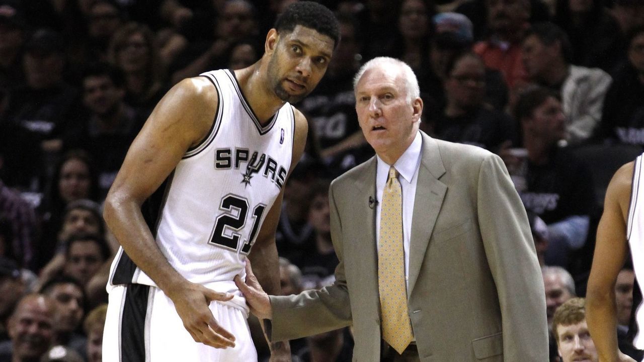 SAN ANTONIO, TX - APRIL 20: Tim Duncan #21 and head coach George Popovich of the San Antonio Spurs discuss strategy while playing the Dallas Mavericks in Game One of the Western Conference Quarterfinals during the 2014 NBA Playoffs at the AT&T Center on April 20, 2014 in San Antonio, Texas. NOTE TO USER: User expressly acknowledges and agrees that, by downloading and/or using this photograph, user is consenting to the terms and conditions of the Getty Images License Agreement.