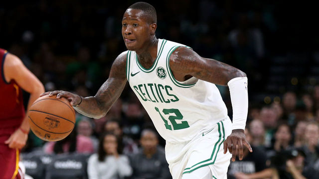 BOSTON, MA - OCTOBER 2: Terry Rozier #12 of the Boston Celtics dribbles against the Cleveland Cavaliers at TD Garden on October 2, 2018 in Boston, Massachusetts.