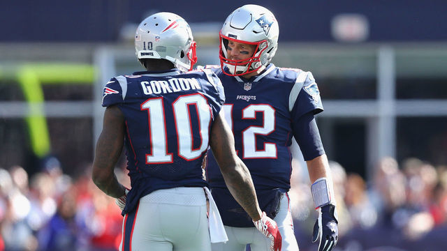 FOXBOROUGH, MA - SEPTEMBER 30: Josh Gordon #10 talks with Tom Brady #12 of the New England Patriots during the second half against the Miami Dolphins at Gillette Stadium on September 30, 2018 in Foxborough, Massachusetts.