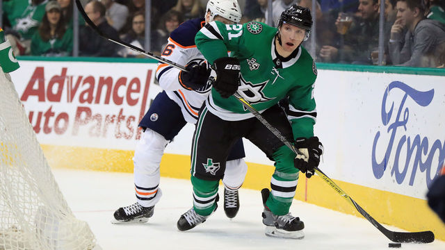DALLAS, TX - JANUARY 06: Antoine Roussel #21 of the Dallas Stars skates the puck against the Edmonton Oilers in the third period at American Airlines Center on January 6, 2018 in Dallas, Texas.