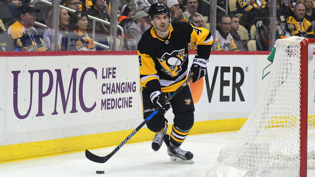 PITTSBURGH, PA - JANUARY 07: Justin Schultz #4 of the Pittsburgh Penguins skates with te puck against the Boston Bruins at PPG PAINTS Arena on January 7, 2018 in Pittsburgh, Pennsylvania.