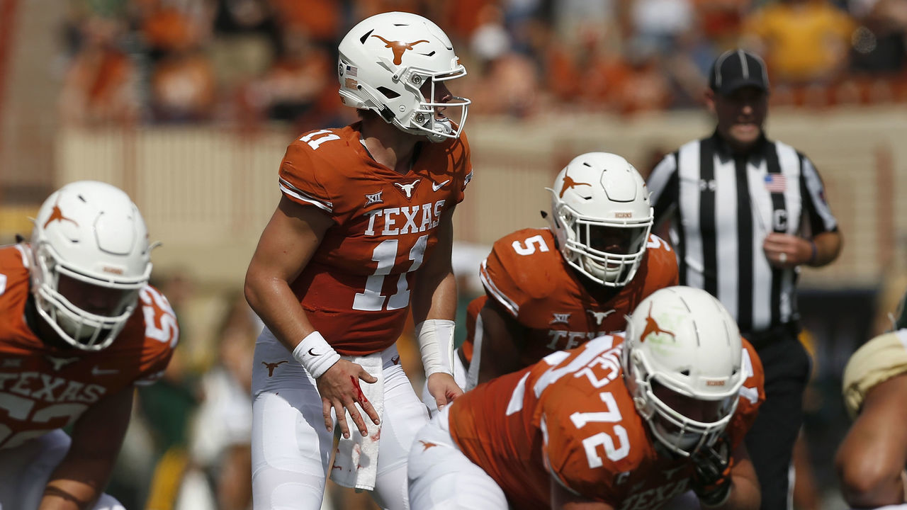AUSTIN, TX - OCTOBER 13: Sam Ehlinger #11 of the Texas Longhorns awaits the snap with blood running from his hand in the first quarter against the Baylor Bears at Darrell K Royal-Texas Memorial Stadium on October 13, 2018 in Austin, Texas.