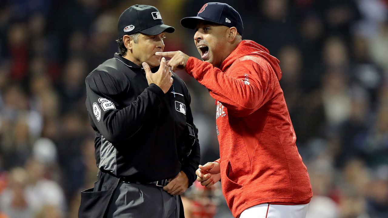 BOSTON, MA - OCTOBER 13: Alex Cora #20 of the Boston Red Sox argues with umpire James Hoye #92 after being ejected after the fifth inning against the Houston Astros in Game One of the American League Championship Series at Fenway Park on October 13, 2018 in Boston, Massachusetts.