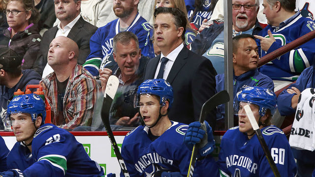 VANCOUVER, BC - OCTOBER 3: Head coach Travis Green of the Vancouver Canucks looks on from the bench during their NHL game against the Calgary Flames at Rogers Arena October 3, 2018 in Vancouver, British Columbia, Canada. 'n