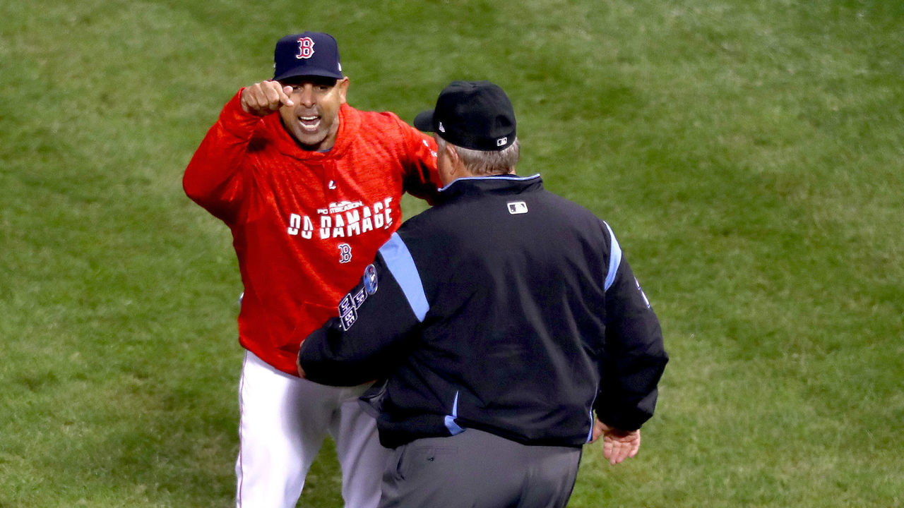 BOSTON, MA - OCTOBER 13: Alex Cora #20 of the Boston Red Sox argues with umpire James Hoye #92 after being ejected after the fifth inning against the Houston Astros in Game One of the American League Championship Series at Fenway Park on October 13, 2018 in Boston, Massachusetts.