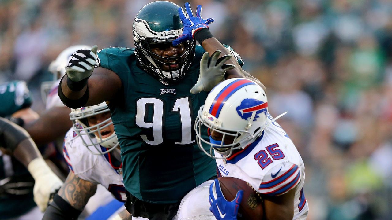 PHILADELPHIA, PA - DECEMBER 13: Fletcher Cox #91 of the Philadelphia Eagles tackles LeSean McCoy #25 of the Buffalo Bills at Lincoln Financial Field on December 13, 2015 in Philadelphia, Pennsylvania.