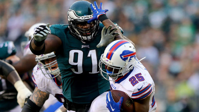 PHILADELPHIA, PA - DECEMBER 13: Fletcher Cox #91 of the Philadelphia Eagles tackles LeSean McCoy #25 of the Buffalo Bills at Lincoln Financial Field on December 13, 2015 in Philadelphia, Pennsylvania.