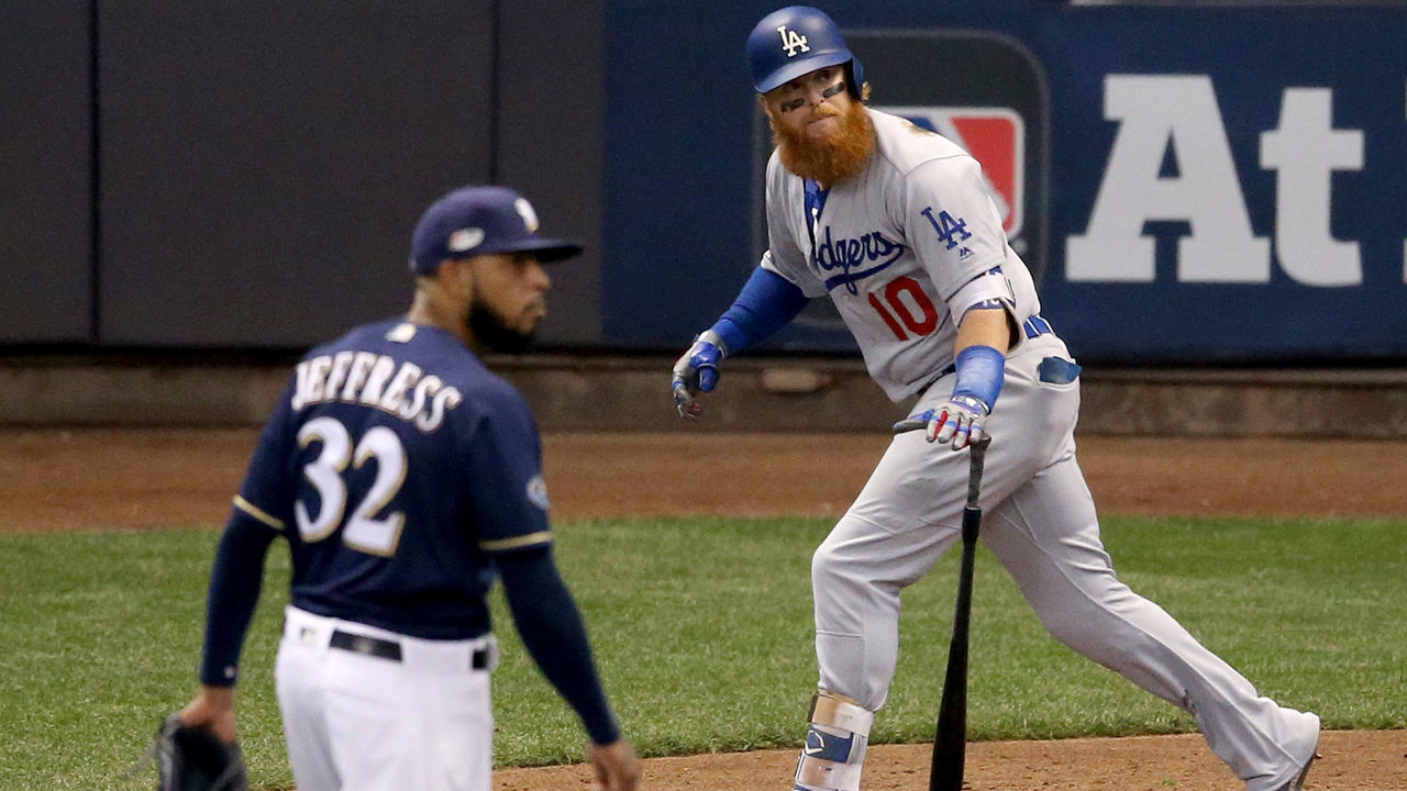 MILWAUKEE, WI - OCTOBER 13: Justin Turner #10 of the Los Angeles Dodgers hits a two run home run against Jeremy Jeffress #32 of the Milwaukee Brewers during the eighth inning in Game Two of the National League Championship Series at Miller Park on October 13, 2018 in Milwaukee, Wisconsin.