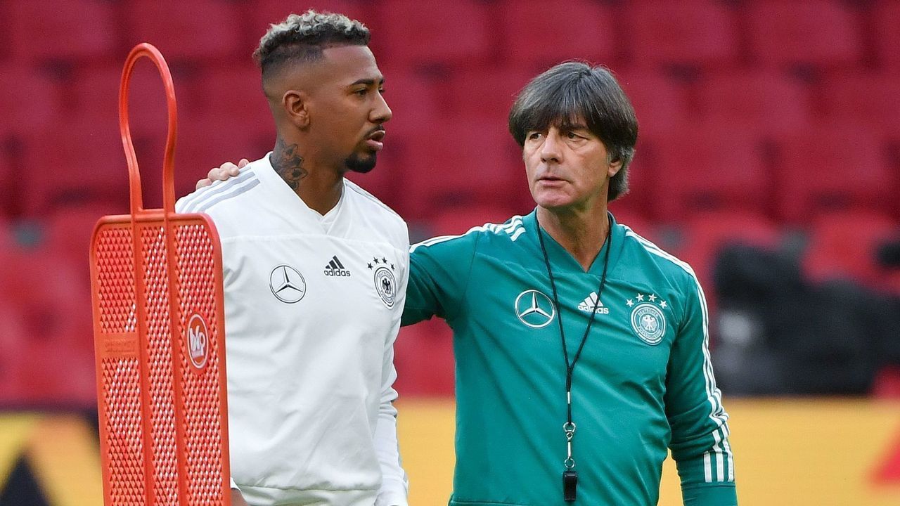 German defender Jerome Boateng (L) and German coach Joachim Low take part in a training session a day before the UEFA Nations League football match between the Netherlands and Germany at the Johan Cruijff Arena in Amsterdam on October 12, 2018.