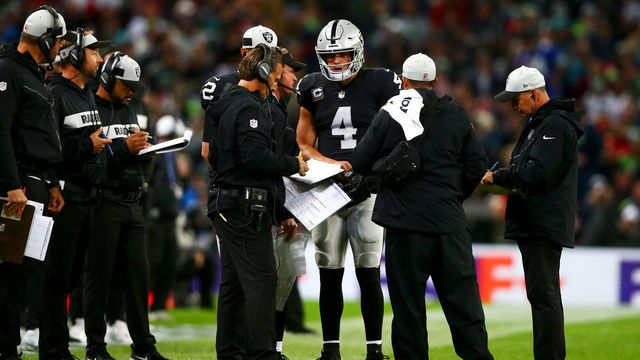 LONDON, ENGLAND - OCTOBER 14: Derek Carr #4 of the Oakland Raiders speaks with head coach Jon Gruden during a timeout in the NFL International Series game between Seattle Seahawks and Oakland Raiders at Wembley Stadium on October 14, 2018 in London, England.