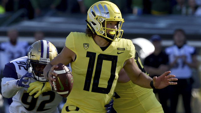 EUGENE, OR - OCTOBER 13: Quarterback Justin Herbert #10 of the Oregon Ducks scrambles in the first half of the game at Autzen Stadium on October 13, 2018 in Eugene, Oregon. The Ducks won the game 30-27.