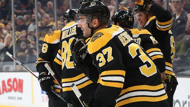 BOSTON - OCTOBER 8: Boston Bruins center Patrice Bergeron (37) skates back to his bench after scoring a hat trick during the third period. The Boston Bruins host the Ottawa Senators in the Bruins' NHL regular season home opener at TD Garden in Boston on Oct. 8, 2018.