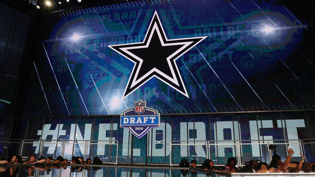 ARLINGTON, TX - APRIL 26: The Dallas Cowboys logo is seen on a video board during the first round of the 2018 NFL Draft at AT&T Stadium on April 26, 2018 in Arlington, Texas.