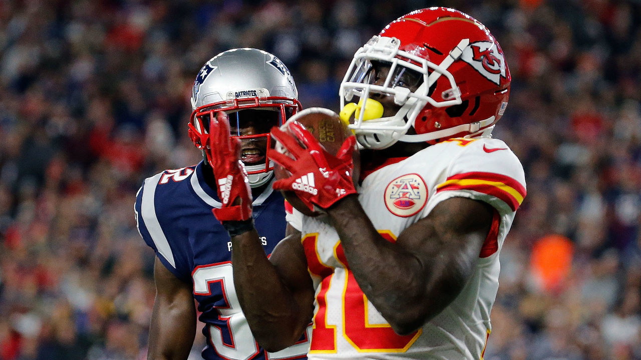 FOXBOROUGH, MA - OCTOBER 14: Tyreek Hill #10 of the Kansas City Chiefs catches a touchdown pass against the defense of Devin McCourty #32 of the New England Patriots in the third quarter at Gillette Stadium on October 14, 2018 in Foxborough, Massachusetts.