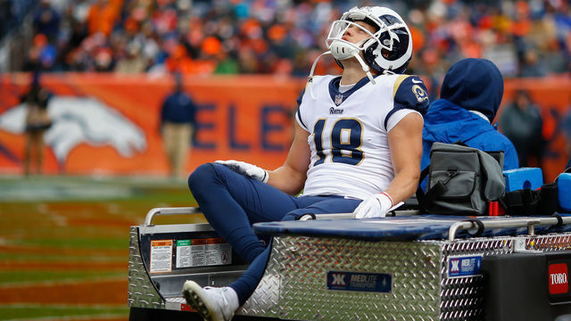 DENVER, CO - OCTOBER 14: wide receiver Cooper Kupp #18 of the Los Angeles Rams is carted off the field with a knee injury during the second quarter against the Denver Broncos at Broncos Stadium at Mile High on October 14, 2018 in Denver, Colorado.