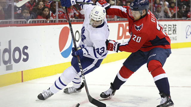 WASHINGTON, DC - OCTOBER 13: Nazem Kadri #43 of the Toronto Maple Leafs and Lars Eller #20 of the Washington Capitals battle for the puck during the second period at Capital One Arena on October 13, 2018 in Washington, DC.