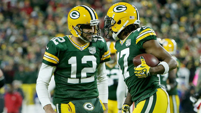 GREEN BAY, WI - OCTOBER 15: Aaron Rodgers #12 and Davante Adams #17 of the Green Bay Packers celebrate after scoring a touchdown in the first quarter against the San Francisco 49ers at Lambeau Field on October 15, 2018 in Green Bay, Wisconsin.