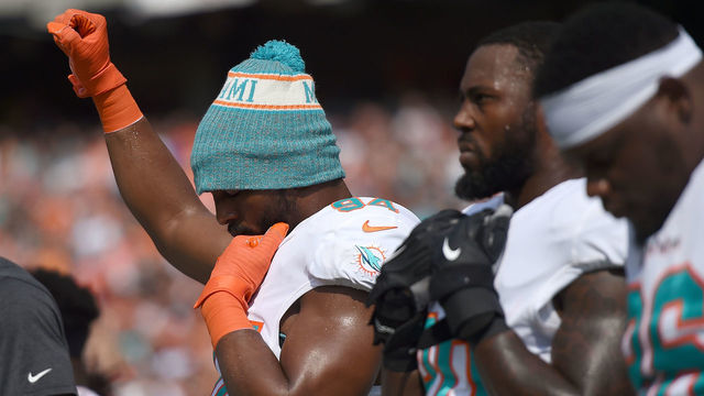 CINCINNATI, OH - OCTOBER 7: Robert Quinn #94 of the Miami Dolphins raises his first during the playing of the national anthem prior to the start of the game against the Cincinnati Bengals at Paul Brown Stadium on October 7, 2018 in Cincinnati, Ohio.