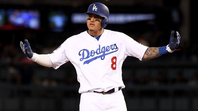 LOS ANGELES, CA - OCTOBER 15: Manny Machado #8 of the Los Angeles Dodgers reacts after hitting a double during the ninth inning against the Milwaukee Brewers in Game Three of the National League Championship Series at Dodger Stadium on October 15, 2018 in Los Angeles, California.