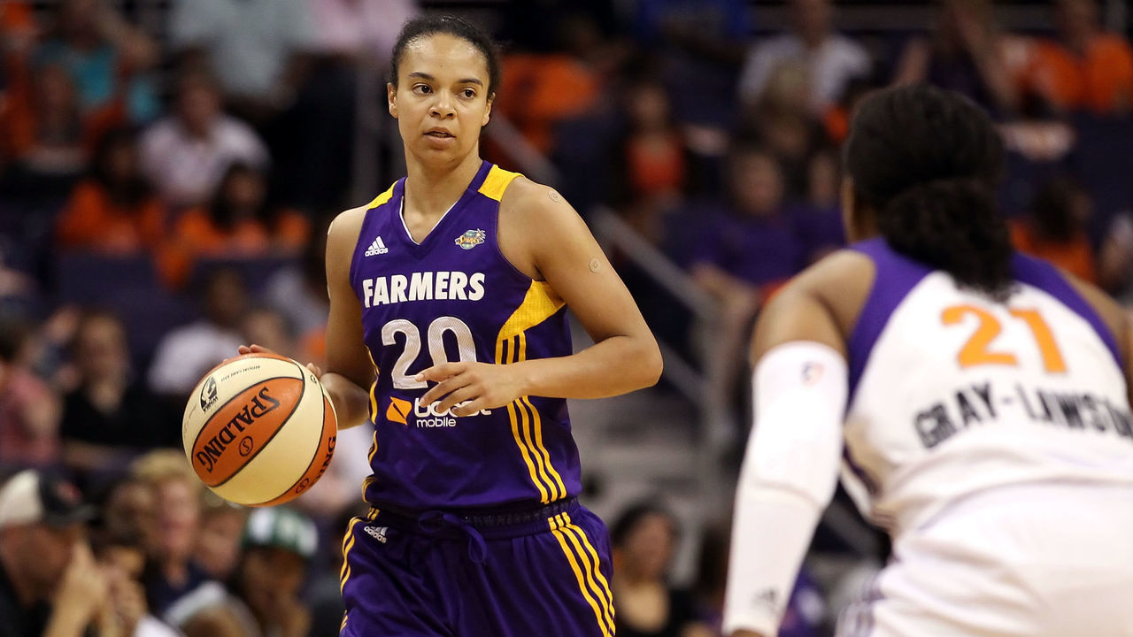 PHOENIX, AZ - MAY 26: Kristi Toliver #20 of the Los Angeles Sparks handles the ball against the Phoenix Mercury during the WNBA game at US Airways Center on May 26, 2012 in Phoenix, Arizona. The Sparks defeated the Mercury 99-88.