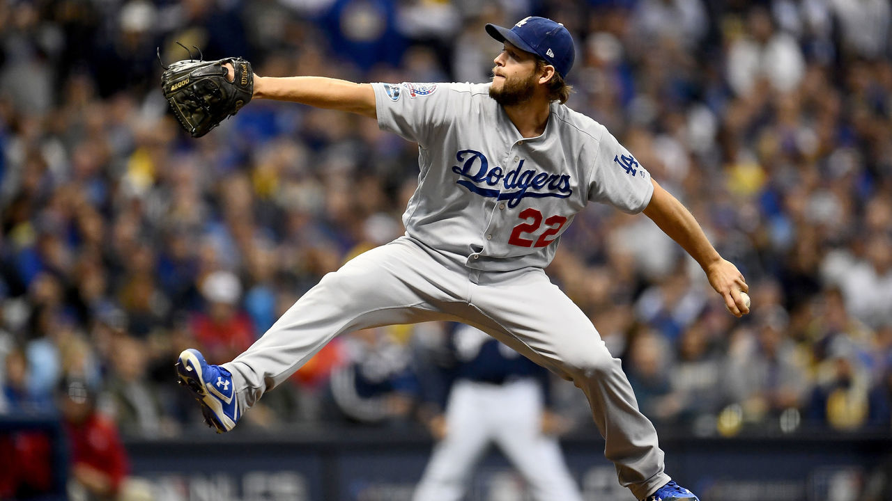 MILWAUKEE, WI - OCTOBER 12: Clayton Kershaw #22 of the Los Angeles Dodgers throws a pitch against the Milwaukee Brewers during the first inning in Game One of the National League Championship Series at Miller Park on October 12, 2018 in Milwaukee, Wisconsin.