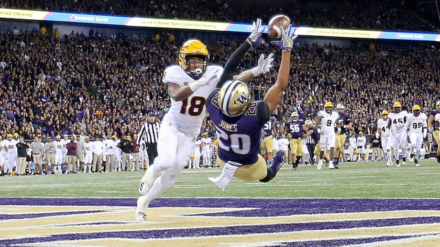 SEATTLE, WA - SEPTEMBER 22: Ty Jones #20 of the Washington Huskies completes a 19 yard touchdown against Langston Frederick #18 of the Arizona State Sun Devils in the first quarter during their game at Husky Stadium on September 22, 2018 in Seattle, Washington.