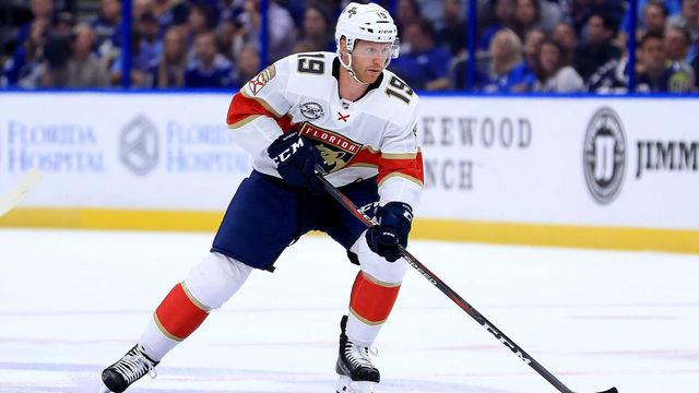 TAMPA, FL - OCTOBER 06: Mike Matheson #19 of the Florida Panthers passes during Opening Night against the Tampa Bay Lightning at Amalie Arena on October 6, 2018 in Tampa, Florida.