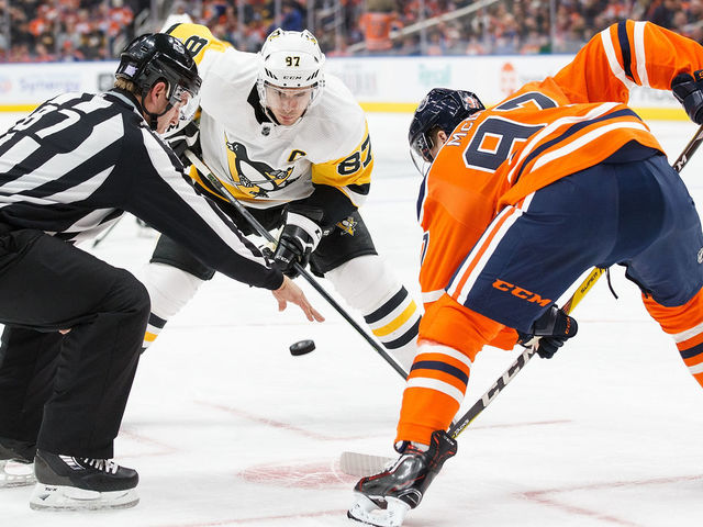 EDMONTON, AB - NOVEMBER 01: Connor McDavid #97 of the Edmonton Oilers faces off against Sidney Crosby #87 of the Pittsburgh Penguins at Rogers Place on November 1, 2017 in Edmonton, Canada.