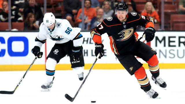 ANAHEIM, CA - SEPTEMBER 28: Nick Ritchie #37 of the Anaheim Ducks skates past Brandon Bollig #52 of the San Jose Sharks during the third period of a preseason game at Honda Center on September 28, 2017 in Anaheim, California.