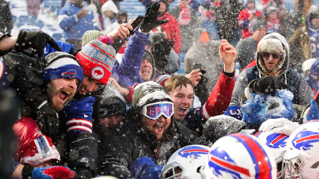ORCHARD PARK, NY - DECEMBER 10: Buffalo Bills fans react as LeSean McCoy #25 of the Buffalo Bills celebrates with them after scoring the game winning touchdown in overtime against the Indianapolis Colts on December 10, 2017 at New Era Field in Orchard Park, New York.