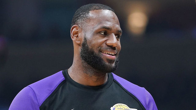 SAN JOSE, CA - OCTOBER 12: LeBron James #23 of the Los Angeles Lakers looks on smiling while there's a time out against the Golden State Warriors during the first half of their NBA preseason basketball game at SAP Center on October 12, 2018 in San Jose, California.