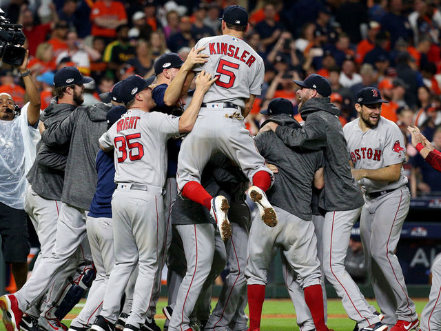 HOUSTON, TX - OCTOBER 18: Members of the Boston Red Sox celebrate after the Red Sox defeated the Houston Astros in Game 5 of the ALCS at Minute Maid Park on Thursday, October 18, 2018 in Houston, Texas.