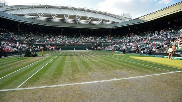 A general view of the state of the grass on centre court on the final day of the 2018 Wimbledon Championships at The All England Lawn Tennis Club in Wimbledon, southwest London, on July 15, 2018.