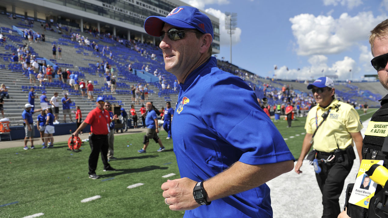 LAWRENCE, KS - SEPTEMBER 15: Head coach David Beaty of the Kansas Jayhawks runs off the field after their 55-14 win over the Rutgers Scarlet Knights at Memorial Stadium on September 15, 2018 in Lawrence, Kansas.