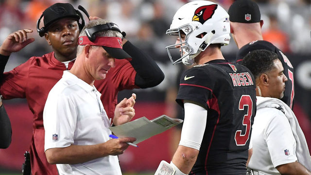 GLENDALE, AZ - OCTOBER 18: Offensive coordinator Mike McCoy (front), quarterbacks coach Byron Leftwich and head coach Steve Wilks talk with quarterback Josh Rosen #3 of the Arizona Cardinals during the second half against the Denver Broncos at State Farm Stadium on October 18, 2018 in Glendale, Arizona.