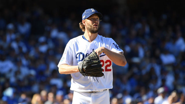 LOS ANGELES, CA - OCTOBER 17: Pitcher Clayton Kershaw #22 of the Los Angeles Dodgers reacts after loading the bases during the third inning of Game Five of the National League Championship Series against the Milwaukee Brewers at Dodger Stadium on October 17, 2018 in Los Angeles, California.