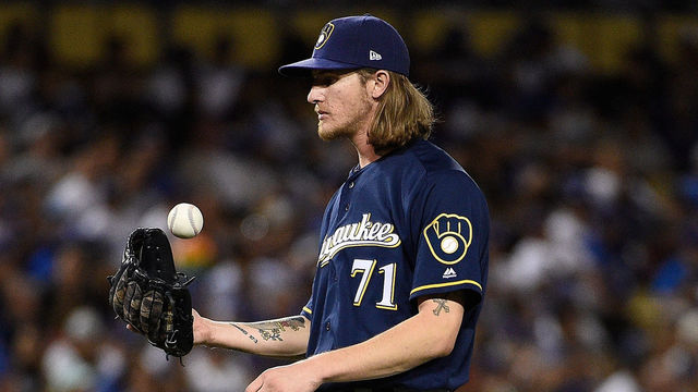LOS ANGELES, CA - OCTOBER 15: Pitcher Josh Hader #71 of the Milwaukee Brewers tosses the ball before pitching in the eighth inning during Game Three of the National League Championship Series against the Los Angeles Dodgers at Dodger Stadium on October 15, 2018 in Los Angeles, California.
