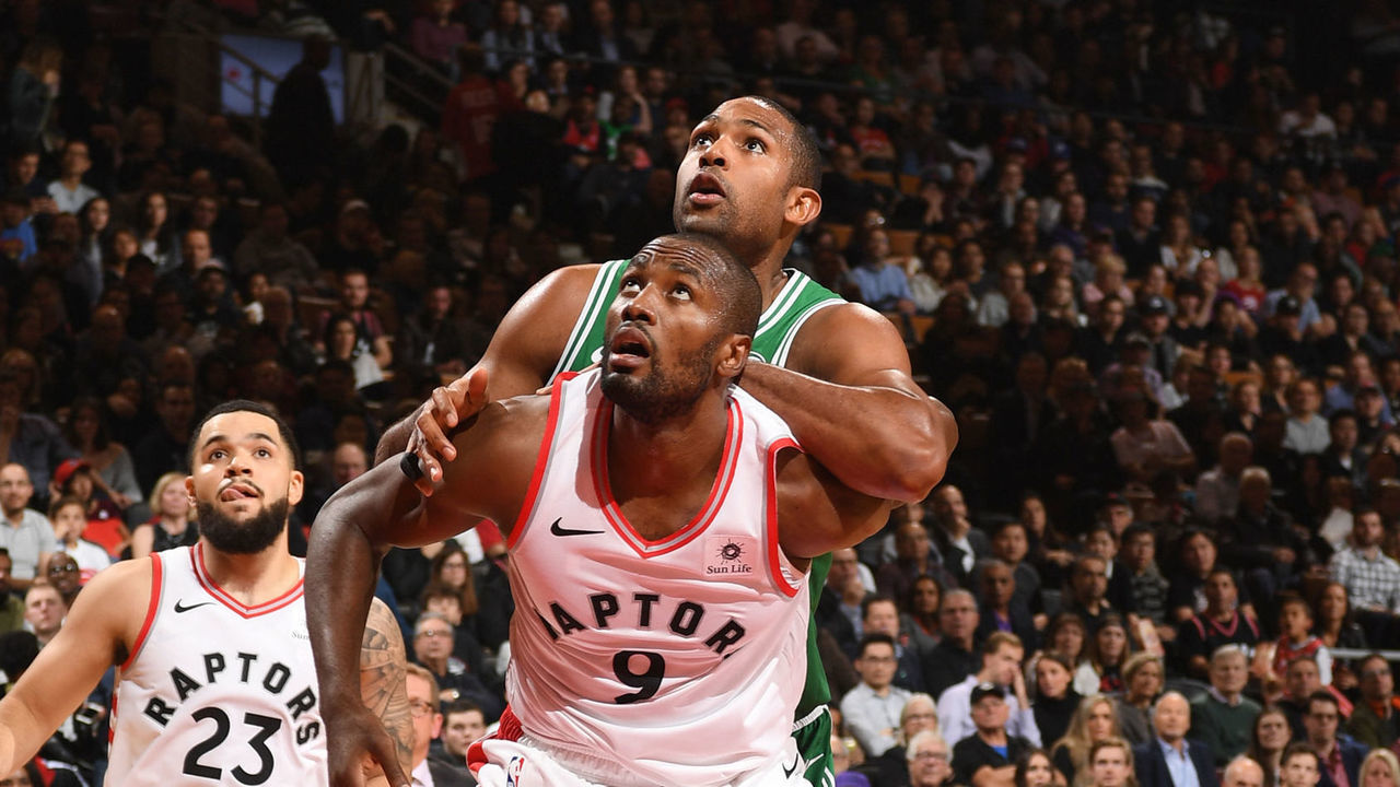 TORONTO, CANADA - OCTOBER 19: Serge Ibaka #9 of the Toronto Raptors boxes out Al Horford #42 of the Boston Celtics during the game on October 19, 2018 at Scotiabank Arena in Toronto, Ontario, Canada. NOTE TO USER: User expressly acknowledges and agrees that, by downloading and/or using this photograph, user is consenting to the terms and conditions of the Getty Images License Agreement. Mandatory Copyright Notice: Copyright 2018 NBAE