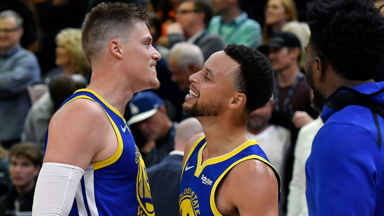 SALT LAKE CITY, UT - OCTOBER 19: Jonas Jerebko #21 of the Golden State Warriors and teammate Stephen Curry #30 react to their 124-123 win over the Utah Jazz at the end of a NBA game at Vivint Smart Home Arena on October 19, 2018 in Salt Lake City, Utah. Jerebko had the winning basket.